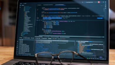 Laptop screen showing debugging software with code, perfect for tech and software development themes.